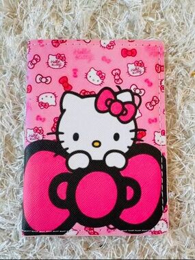 NWT Hello Kitty Pink Bow Passport Sleeve cover.